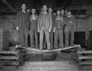 Men standing on plywood